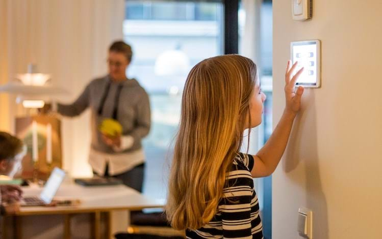 Young girl using wall tablet